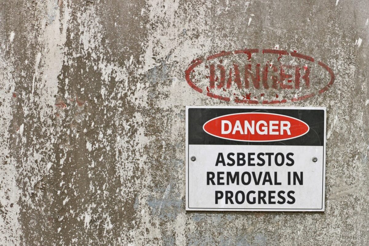 red, black and white Danger, Asbestos Removal in Progress warnin